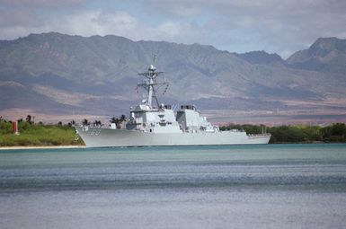 Port bow view of the Arleigh Burke Aegis type guided missile destroyer USS PAUL HAMILTON (DDG 60) heading down the channel after departing Pearl Harbor. The ship is en route to the waters south of Hawaii to take part in Operation RIMPAC 2000 with other units of the multi-national force