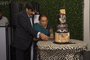 Mr and Mrs Raniga, cutting the Fiji Day Cake at inaugural fund raising dinner for maternal care hospitals in Fiji, 8 October 2021 / Michael Singh