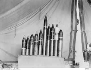 FINSCHHAFEN - SIO AREA, NEW GUINEA, 1944-03-31. JAPANESE AMMUNITION COLLECTED FROM DUMPS IN THE AREA BY THE CHIEF ENGINEER'S BRANCH, HEADQUARTERS 2ND AUSTRALIAN CORPS. THE AMMUNITION DISPLAYED, ..