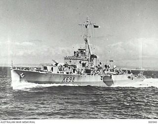 NEW GUINEA 1947-08-20. PORT BOW VIEW OF THE RIVER CLASS FRIGATE HMAS CONDAMINE (K698) AT SPEED AS SHE PROCEEDS TO THE AID OF A GROUNDED SHIP, EITHER THE CYTENA OR REYNELLA. CLEARLY SHOWN IS THE ..