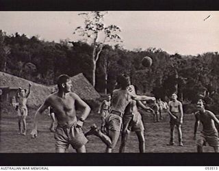 SOGERI VALLEY, NEW GUINEA, 1943-06-25. TROOPS OF THE 11TH AUSTRALIAN FIELD AMBULANCE, MAIN DRESSING STATION, PLAYING SOCCER DURING ONE OF THEIR RECREATION PERIODS. SHOWN: Q48593 LANCE CORPORAL ..