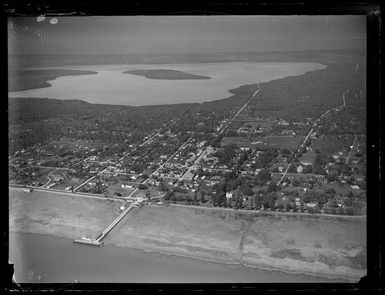 An aerial view of the Tongan coastal capital Nuku'alofa with the Lagoons of Fanga'uta and Fanga Kakau beyond, Tonga