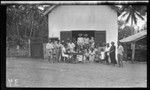 Group at Mauke, listening to a health talk