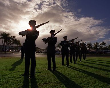 Hickam AIr Force Base, Hawaii, honor guard perform a 21 gun salute, with M-1 rifles, for the December 7th, 1941, ceremony in front of the 15th Air Base Wing Headquarters on December 7th, 1999