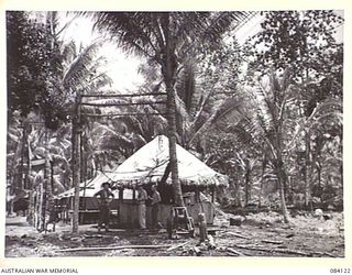 MALMAL VILLAGE, JACQUINOT BAY. NEW BRITAIN. 1944-12-09. THE SIGNAL SECTION AREA, HEADQUARTERS 5 DIVISION