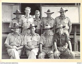 PALMALMAL, JACQUINOT BAY, NEW BRITAIN, 1945-08-31. NAVAL OFFICERS AND MEMBERS OF 53 PORT CRAFT COMPANY ROYAL AUSTRALIAN ENGINEERS. IDENTIFIED PERSONNEL ARE:- LIEUTENANT R V DAVIES ROYAL AUSTRALIAN ..