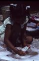 Native girl washing clothes, Rongelap Island, August 24, 1964