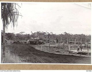 DREGER HARBOUR, NEW GUINEA. 1943-12-05. SLEEPING QUARTERS OF THE 342ND UNITED STATES FIGHTER SQUADRON, UNDER CONSTRUCTION