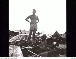 DONADABU, NEW GUINEA. 1943-11-03. NX126537 ACTING STAFF SERGEANT G. TINSON (LEFT) AND NX163375 SAPPER J. O'LEARY OF NO. 3 PLATOON, 18TH AUSTRALIAN FIELD PARK COMPANY, ROYAL AUSTRALIAN ENGINEERS, ..
