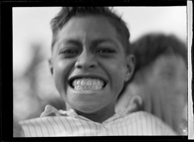 A close-up portrait of a local Tongan boy, Tonga