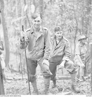 PAPUA, NEW GUINEA. 1942-10-06. LIEUTENANT COLONEL A.W. BUTTROSE, COMMANDING OFFICER 2/33RD AUSTRALIAN INFANTRY BATTALION, WITH STICK, AND MAJOR G.F. LARKIN, BRIGADE MAJOR, 25TH AUSTRALIAN INFANTRY ..