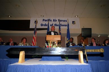 GEN John G. Lorber, Commander, Pacific Air forces, speaks at his Pacific Air Forces Order of the Sword ceremony held in the Tradewinds enlisted Club