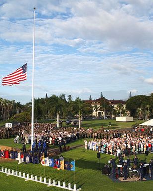 The American Flag is lowered to half mast during a Flagpole Ceremony held at Hickam AFB, Hawaii (HI) to commemorate the attack on Hickam Field during the WWII Japanese invasion