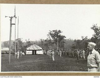 SOGERI, NEW GUINEA. 1943-11-20. DAILY PARADE A THE SCHOOL OF SIGNALS, NEW GUINEA FORCE. SHOWN ARE: NX35052 LIEUTENANT COLONEL D. JUNOR (1); QX40795 CAPTAIN R. W. J. CROSBY (2); QX43156 LIEUTENANT ..