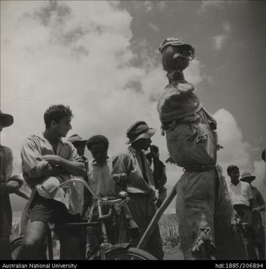 Farmers with scarecrow