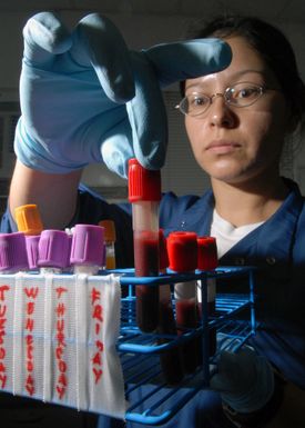 U.S. Navy PETTY Officer 2nd Class Diana Rodriguez, a Medical Laboratory Technician, works a specimen analysis at the U.S. Naval Hospital Guam, Branch Medical Clinic laboratory located on Naval Base Guam. Rodriguez performs routine tests in the laboratory to provide data for use in diagnosis and treatment of patients. (U.S. Navy PHOTO by Mass Communication SPECIALIST 2nd Class John F. Looney) (Released)