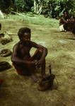 [Man sitting on ground], Wewak rural area, 1964