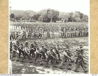 POM POM VALLEY, NEW GUINEA. 1943-11-30. 2/12TH AUSTRALIAN INFANTRY BATTALION, MARCHING OFF THE SPORTSGROUND AFTER AN INSPECTION BY THEIR COMMANDING OFFICER, QX6008 LIEUTENANT COLONEL C. C. F. ..