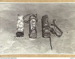 NEW GUINEA. 1943-11-24. JAPANESE SMOKE CANDLES, FRICTION IGNITED, WITH GROUND SPIKE. THIS EQUIPMENT HAS BEEN PREPARED FOR DEMONSTRATION PURPOSES BY THE COMMAND ROYAL ENGINEERS HEADQUARTERS, 9TH ..