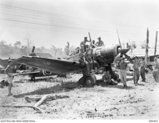 BUT, NEW GUINEA. 1945-04-02. A SINGLE ENGINED "SONIA" JAPANESE RECONNAISSANCE FIGHTER AIRCRAFT, THE ONLY PLANE TO ESCAPE PRACTICALLY UNSCATHED FROM THE BLITZ ON BUT AERODROME. IT IS BEING ..