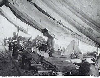 0R0 BAY, NEW GUINEA. 1943-04. PATIENTS ON STRETCHER BEDS IN A SECTION OF THE INTERIOR OF ONE OF THE WARDS OF 10TH FIELD AMBULANCE