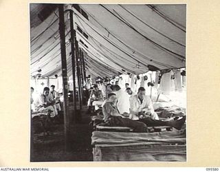 CAPE WOM, WEWAK AREA, NEW GUINEA. 1945-08-28. THE INTERIOR OF MEDICAL WARD 4, 104 CASUALTY CLEARING STATION WHICH TREATS BOTH MALARIA PATIENTS AND THOSE WITH SKIN CONDITIONS