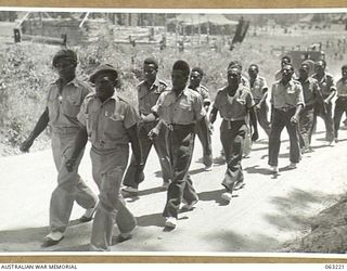 SOUTHPORT, QLD. 1944-01-18. A PARTY OF NEW GUINEA POLICE BOYS MARCHING TO THE PARADE GROUND TO WITNESS A DEMONSTRATION BY TROOPS OF THE 4TH ARMOURED BRIGADE