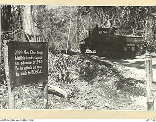 FINSCHHAFEN AREA, NEW GUINEA. 1944-03-13. ONE OF MANY BATTLE SIGNS IN THE FINSCHHAFEN AREA, THIS SIGN BETWEEN THE SONG RIVER AND NORTH HILL RECORDS THE ACTIVITIES OF THE 2/28TH INFANTRY BATTALION