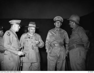 NEW GUINEA 1942-10-12. MR FRANK FORDE, AUSTRALIAN MINISTER FOR THE ARMY, GENERAL DOUGLAS MACARTHUR, GENERAL THOMAS BLAMEY AND MAJOR GENERAL GEORGE KENNEY, UNITED STATES ARMY AND COMMANDING OFFICER ..