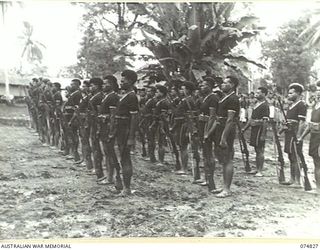 LAE, NEW GUINEA. 1944-07-22. THE GUARD OF HONOUR DRAWN FROM THE ROYAL PAPUAN CONSTABULARY DURING A PARADE FOR THE GENERAL OFFICER COMMANDING, AUSTRALIAN NEW GUINEA ADMINISTRATIVE UNIT