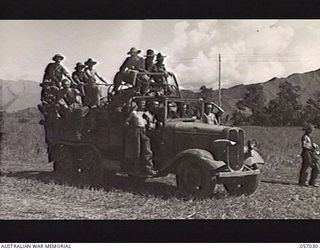 NADZAB, NEW GUINEA. 1943-09-19. A CAPTURED JAPANESE TRUCK LOADED WITH TROOPS OF THE 25TH AUSTRALIAN INFANTRY BRIGADE, 7TH AUSTRALIAN DIVISION