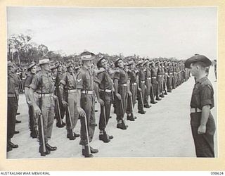 WEWAK, NEW GUINEA. 1945-10-26. A CEREMONIAL PARADE AND MARCH PAST BY 6 DIVISION WAS INSPECTED BY GENERAL SIR THOMAS A. BLAMEY, COMMANDER-IN-CHIEF, ALLIED LAND FORCES, SOUTH WEST PACIFIC AREA, AT ..