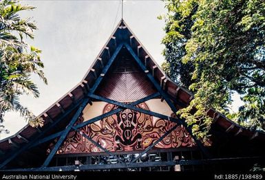 Fiji - triangular building with mural of black figure on red