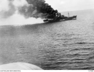 BISMARCK SEA. 1943-03-03. PHOTOGRAPHED FROM A BEAUFIGHTER BOMBER AIRCRAFT PILOTED BY 260353 FLIGHT LIEUTENANT R. F. UREN OF NO. 30 SQUADRON RAAF. A JAPANESE TRANPORT SHIP ON FIRE DURING THE BATTLE ..