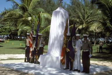 A joint Marine Corps/Navy color guard stands at attention at the Congressional Medal of Honor Monument honors four Marines for the heroism above and beyond the call of duty while fighting the Japanese during World War II. They are Captain Louis Wilson Jr., Private First Class (PFC) Leonard Mason, PFC Luther Skaggs and PFC Frank Witek