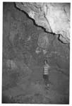 Person standing in cave