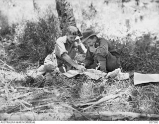 KAIAPIT, NEW GUINEA. 1943-09-25. VX9 MAJOR GENERAL G.A. VASEY, CB, OBE, DSO., GENERAL OFFICER COMMANDING, 7TH AUSTRALIAN DIVISION (LEFT) AND NX148 BRIGADIER I.N. DOUGHERTY, DSO., BRIGADE COMMANDER, ..