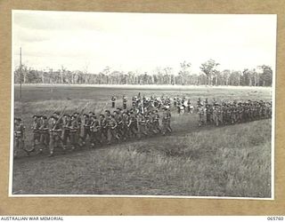 WONDECLA, QLD. 1944-04-15. "B" COMPANY, 2/1ST INFANTRY BATTALION GIVE "EYES RIGHT" AS THEY MARCH PAST THEIR COMMANDING OFFICER, NX163 LIEUTENANT COLONEL P.A. CULLEN, DSO. (1), WITH THE BATTALION ..