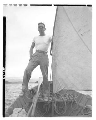 [Negative of a Sailor Standing on the Edge of a Boat]