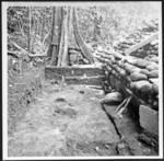 Trench behind ahu of coastal marae site 129 looking from E-W corner stone at lower right. Detail showing layers of fill