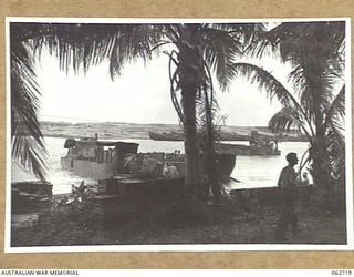 SIALUM, NEW GUINEA. 1944-01-05. LOOKING TOWARDS SIALUM ISLAND FROM THE BEACH. THIS ISLAND AFFORDS PROTECTION FOR BARGES ON THE BEACH DURING THE EARLY MONSOON MONTHS