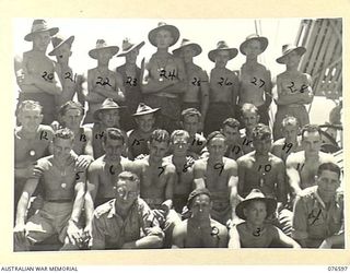 CAPE GLOUCESTER, NEW BRITAIN. 1944-15.0-15. PERSONNEL OF THE 2/31ST DOCKS OPERATING COMPANY ABOARD THE DUTCH TROOPSHIP "SWEARTENHONDT" AFTER THEY HAD UNLOADED SOME 1300 CUBIC TONS OF STORES AND ..