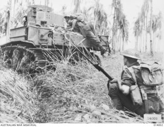 1943-01-02. PAPUA. GIROPA POINT. AUSTRALIAN MANNED GENERAL STUART M3 TANKS ATTACK JAPANESE PILLBOXES IN THE FINAL ASSAULT ON BUNA. CORPORAL R. F. RODGERS, D COMPANY, 2/12TH BATTALION, WARNS THE ..