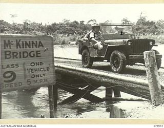 TOKO, BOUGAINVILLE, SOLOMON ISLANDS. 1945-03-26. VX1 GENERAL SIR THOMAS BLAMEY, GBE, KCB, CMG, DSO, ED, COMMANDER- IN- CHIEF, ALLIED LAND FORCES, SOUTH WEST PACIFIC AREA (1) CROSSES THE PURIATA ..