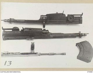 LAE, NEW GUINEA. 1944-09-15. THE EFFECTS OF TROPICAL CONDITIONS ON VARIOUS PARTS OF BREN GUNS USING VACUUM PRESERVAC OIL SA. THESE TRIALS OF CORROSION PREVENTING LUBRICANTS FOR SMALL ARMS UNDER ..