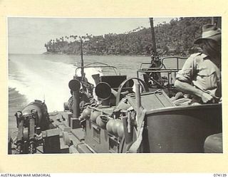 BAM ISLAND, NEW GUINEA. 1944-06-19. A UNITED STATES NAVY TORPEDO BOAT CARRYING A PATROL FROM THE 24TH INFANTRY BATTALION LEAVING THE ISLAND AFTER INVESTIGATING RUMOURS OF A JAPANESE RADIO STATION ..