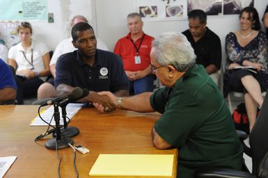 Earthquake ^ Tsunami - Pago Pago, American Samoa, October 6, 2009 -- Governor Togiola Tulafono and Federal Coordinating Officer Kenneth Tingman shake hands after signing the memorandum of agreement on the disaster response to the recent earthquake and tsunami. The two leaders have been working closely together on response and recovery since the tsunami one week ago. FEMA/Casey Deshong