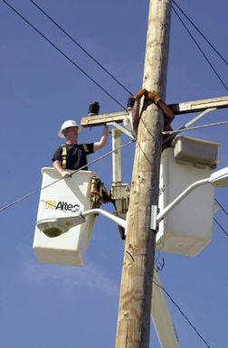 US Air Force (USAF) AIRMAN First Class (A1C) Sean Mackey, left, from Andersen Air Force Base (AFB), Guam and SENIOR AIRMAN (SRA) Thomas Manns from Elmendorf AFB, Alaska, repair electrical lines