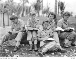 NEW BRITAIN. 1945-03-20. MEMBERS OF THE ARMY MEDICAL WOMEN'S SERVICE WHO HAVE RECENTLY ARRIVED, WRITE THEIR FIRST LETTERS HOME FROM NEW BRITAIN. IDENTIFIED PERSONNEL ARE: VFX95193 PRIVATE I. BENTON ..