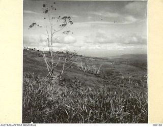 SATTELBERG, NEW GUINEA. 1944-07-06. GENERAL SCENERY VIEWED FROM THE SUMMIT OF SATTELBERG. THE PHOTOGRAPH WAS TAKEN FOR USE BY VX76415 LIEUTENANT R.B. EWERS, OFFICIAL WAR ARTIST, MILITARY HISTORY ..